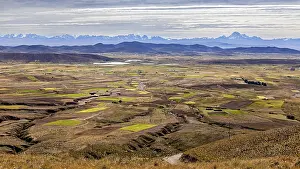 Cloudy Mountain Backdrop Prints: Wide landscape with fields and distant mountains