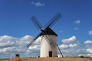 Campo De Criptana Windmill Prints: A windmill under a clear, cloudy sky