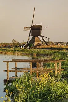 Prints of Windmill at sunset, Kinderdijk, UNESCO World Heritage, Zuid-Holland, Netherlands Heritage Site Prints: Kinderdijk Windmill Print at Sunset, Netherlands
