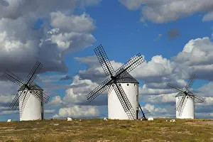 Campo De Criptana Landscape Prints: Three windmills in front of a dramatic sky with imposing clouds