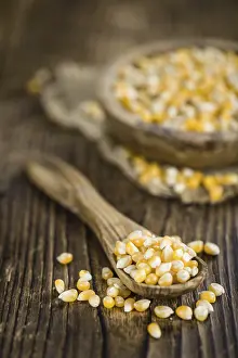 Selective Focus Food Prints: Wooden table with a portion of Corn (selective focus)