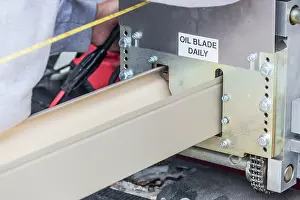 Rain Gutter Installation Prints: Worker Measuring Rain Gutter Processing Through Seamless Shaping Machine