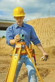 Protective Clothing Prints: A worker with theodolite