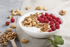 Fresh Fruit And Nuts Prints: Yoghurt with raspberry, granola