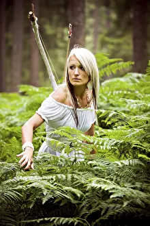 Tropical Forest Landscape Photo Prints: A young amazon with a bow in the rainforest