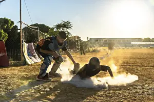 Dusty Baseball Field Prints: Young baseball player slides into base