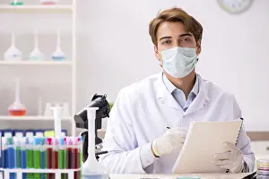 Scientific Researcher Prints: Young chemist working in the lab