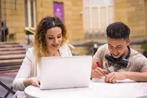 Young Adult Professionals Working Together Prints: Young entrepreneurs doing teamwork