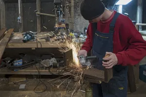 Young Man In Workshop Prints: Young man at a Flex in his workshop