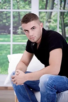 Caucasion Male Model Prints: Young man on a sofa
