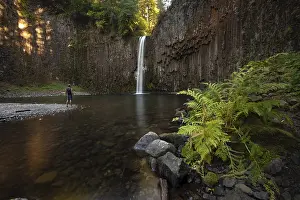 Young Man In Front Of Waterfall Prints: Young man in front of waterfall