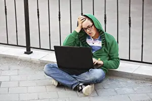 University Campus Portrait Prints: Young student using laptop