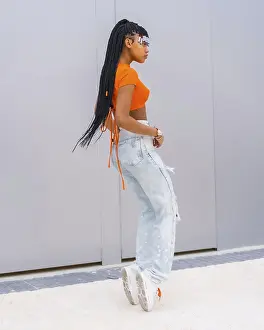 Youthful Dance Movement Prints: A young trap dancer with braids