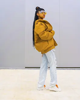Orange Sunglasses Fashion Prints: A young trap dancer with braids