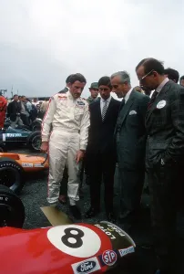 Graham Hill Prints: British GP 1968 Print: Graham Hill with Prince Charles and Lord Mountbatten