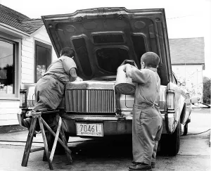 Print of Dwarfs working on a car at a service station