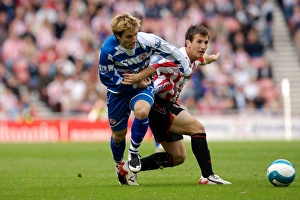 Bobby Convey takes on the Sunderland defence Bobby Convey takes on the Sunderland defence