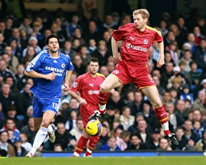 Brynjar Gunnarsson takes control watched by Michael Ballack Brynjar Gunnarsson takes control watched by Michael Ballack
