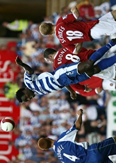 Ibrahima Sonko heads clear of Wayne Rooney & Paul Scholes Ibrahima Sonko heads clear of Wayne Rooney & Paul Scholes