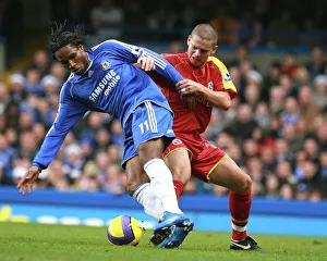 Ivar Ingimarsson stays close to Chelseas top goal scorer Didier Drogba Ivar Ingimarsson stays close to Chelseas top goal scorer Didier Drogba