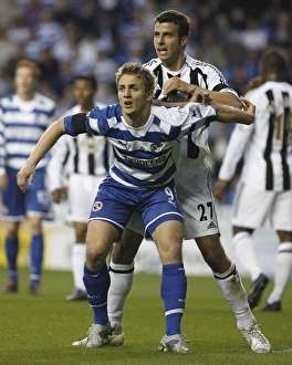 Kevin Doyle resists pressure from Steven Taylor Kevin Doyle resists pressure from Steven Taylor