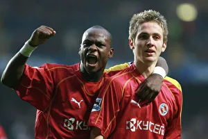 Leroy Lita and Kevin Doyle salute Reading fans after Michael Essiens own goal to make Leroy Lita and Kevin Doyle salute Reading fans after Michael Essiens own goal to make