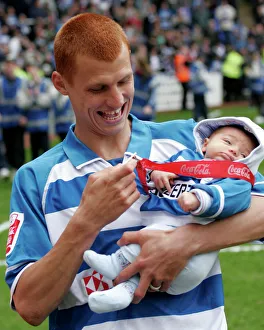 Steve Sidwell shows his baby son his new medal Steve Sidwell shows his baby son his new medal