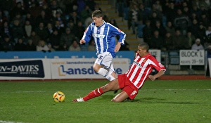 Alex Revell is fouled by Gavin Caines to win a last-minute penalty Alex Revell is fouled by Gavin Caines to win a last-minute penalty