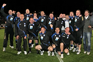 Gus and his backroom staff celebrate promotion to The Championship in 2011 Gus and his backroom staff celebrate promotion to The Championship in 2011
